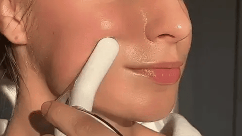 Close-up demonstration of the device on skin